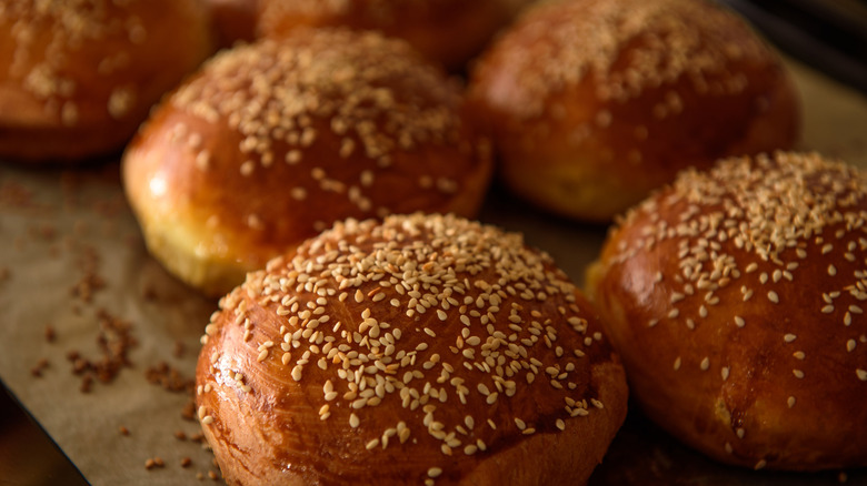 Homemade burger rolls sprinkled with sesame seeds