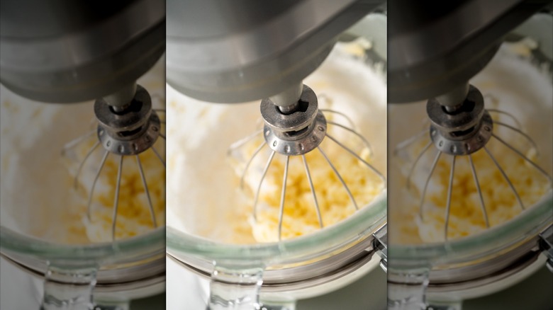 Ingredients in stand mixer with mixer in bowl