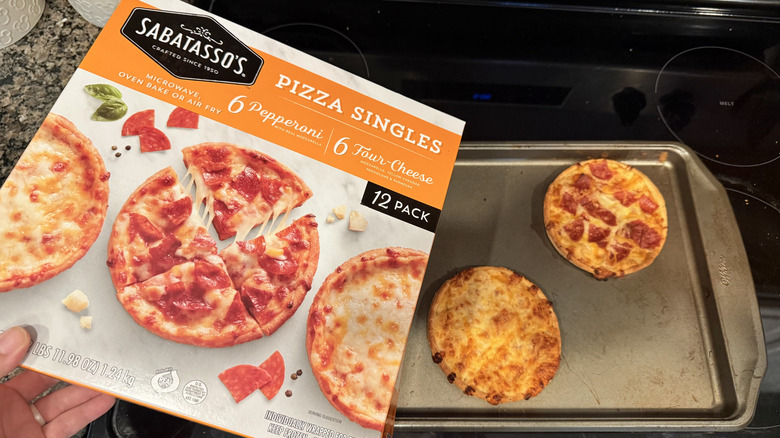Cooked Sabatasso's pizza singles on pan with box