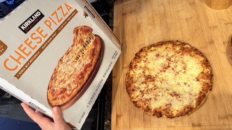 Cooked Kirkland cheese pizza with box