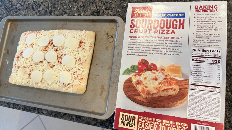 Uncooked Bari's Sourdough Crust Cheese Pizza on pan