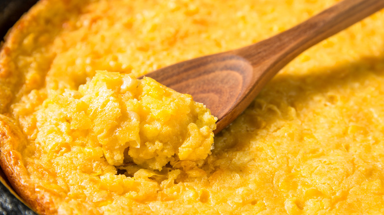 Cornbread pudding and a wooden spoon