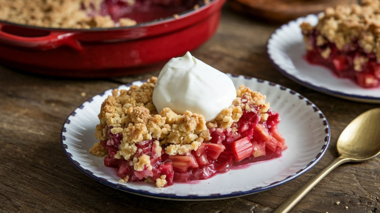 Strawberry rhubarb crumble on a white plate