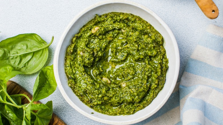 Fresh pesto sauce in a white bowl