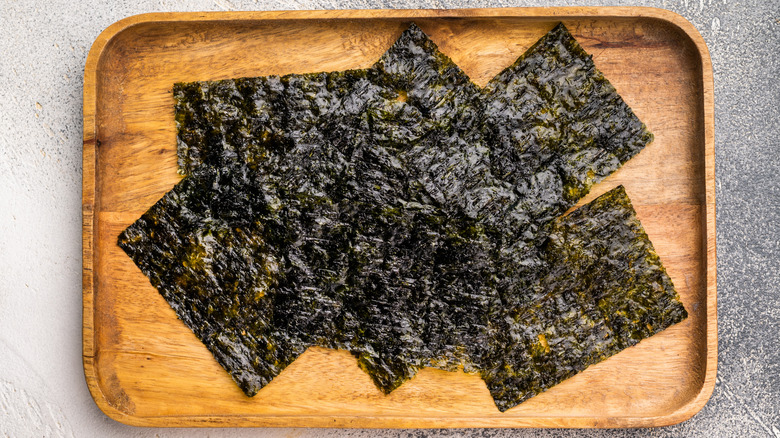 Crispy Nori seaweed sheets in a wooden tray