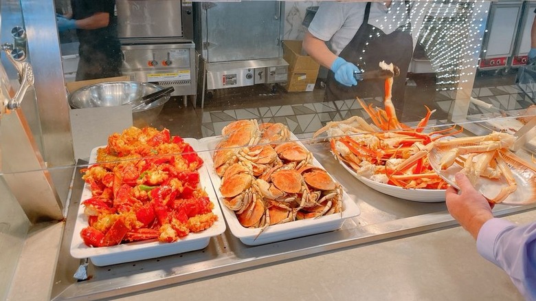 A variety of whole crabs and crab legs being served at Gohan A.Y.C.E. Buffet