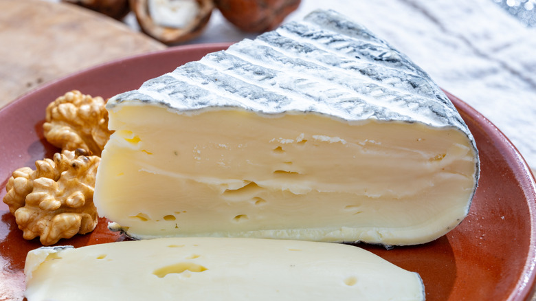 French chèvre cheese on a plate with walnuts