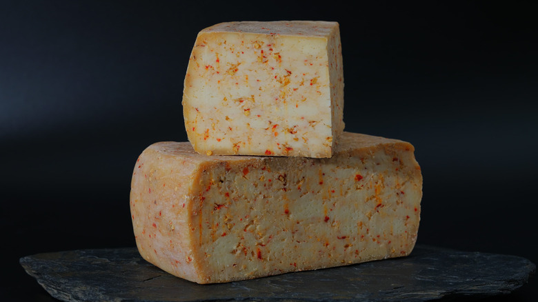 Stacked pieces of pepper jack cheese