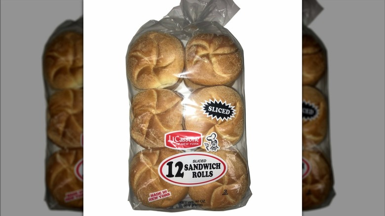 J.J. Cassone sliced sandwich rolls on a white background, mirrored
