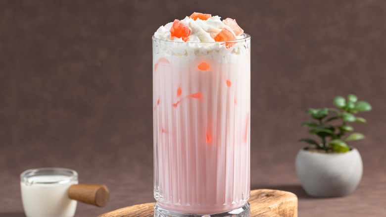 Pink bubble gum drink in a tall glass