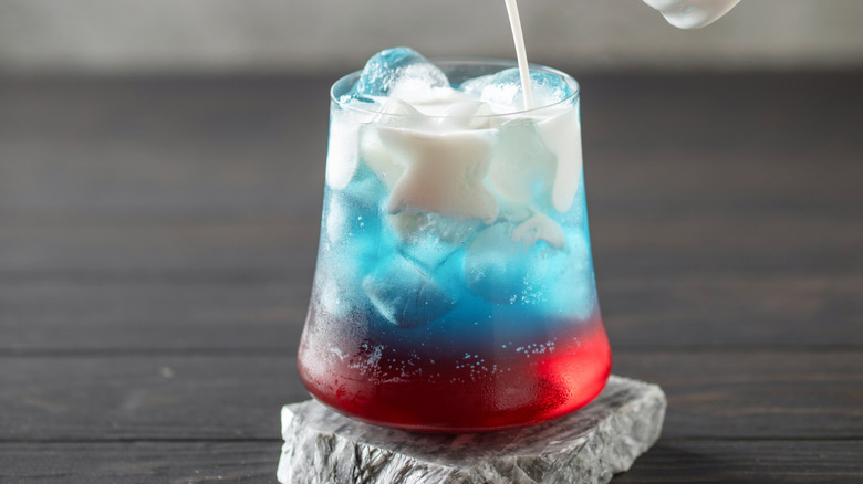 Blue dirty soda with cream in a glass