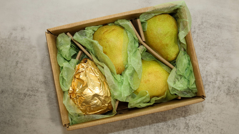 Box of Comice pears with gold foil wrapping