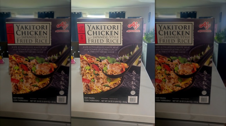 Ajinomoto yakitori chicken fried rice in product box sitting on a kitchen counter, mirrored
