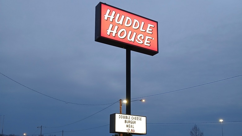 A sign for the Huddle House restaurant