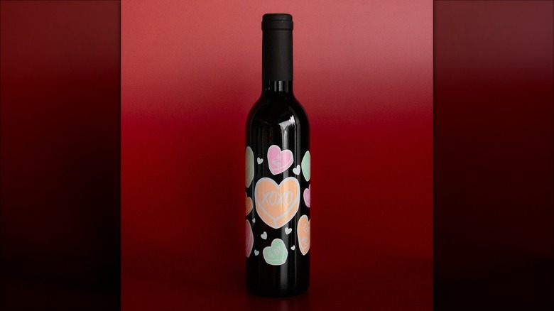 wine bottle decorated with conversation hearts