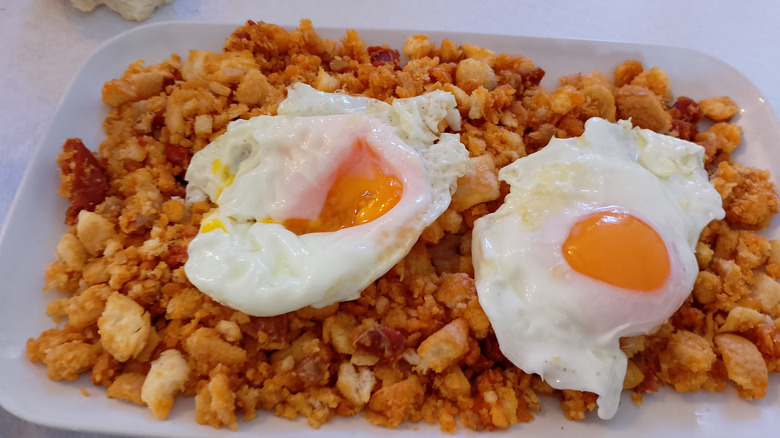 Migas ("crumbs" in English) is a dish traditionally made from stale bread and other ingredients in Spanish and Portuguese cuisine