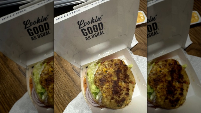 A Culver's burger with the bun missing, mirrored