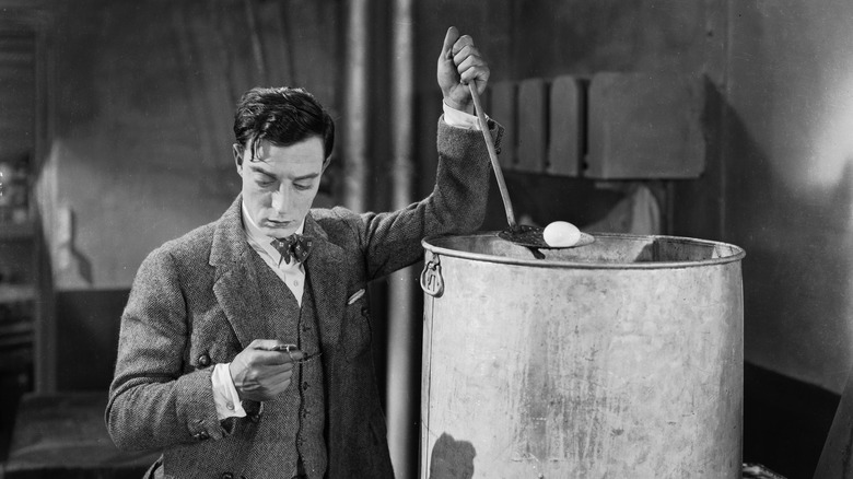 Buster Keaton trying to boil an egg