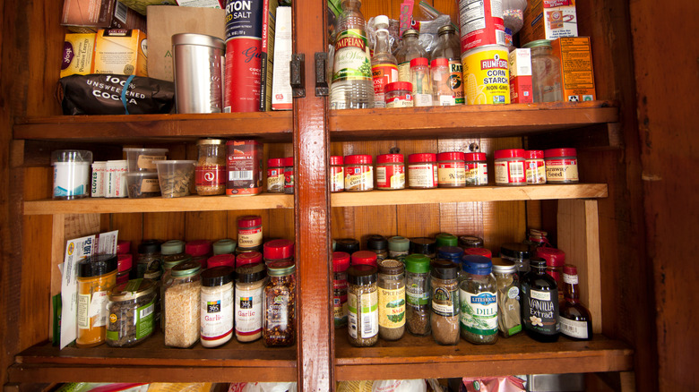 A cabinet of spices and food ingredients