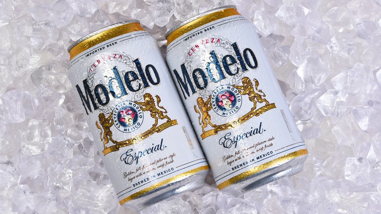 two modelo beer cans over ice