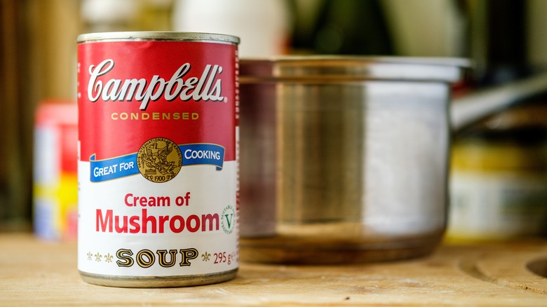 Campbell's cream of mushroom soup can by stainless steel pot
