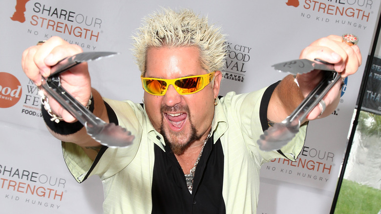 Guy Fieri grilling at an event