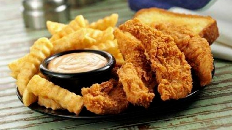 Zaxby's chicken tenders with fries, toast, and sauce
