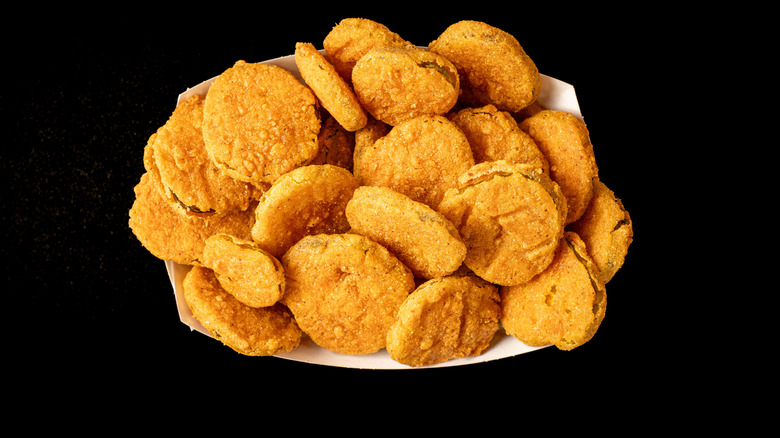 Deep fried pickles in a paper basket
