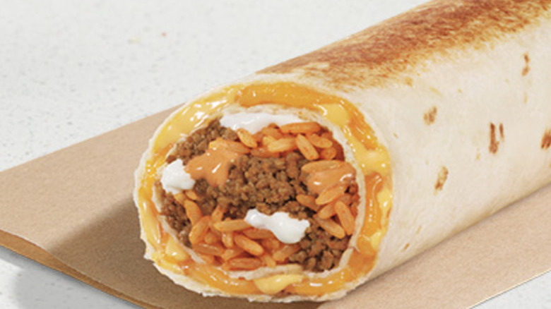 Taco Bell Quesarito on top of a paper bag