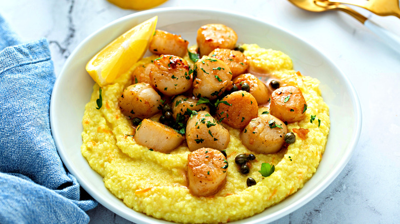 Bowl of grits with scallops