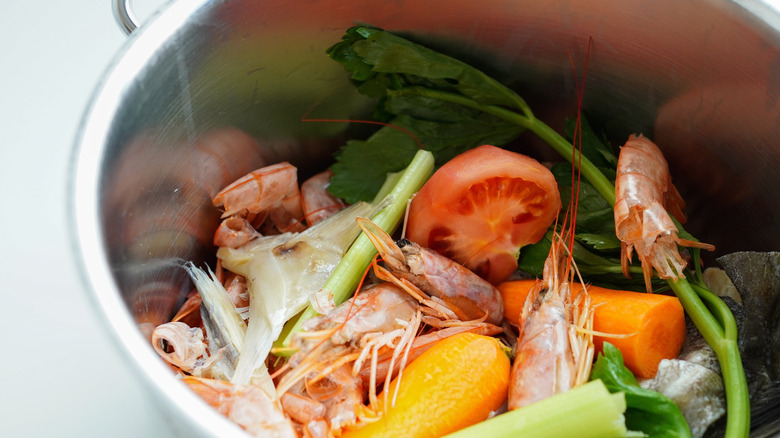 Ingredients for homemade shrimp stock in stock pot