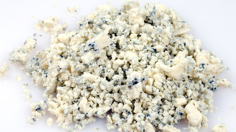 A pile of Blue Cheese crumbled into small pieces.