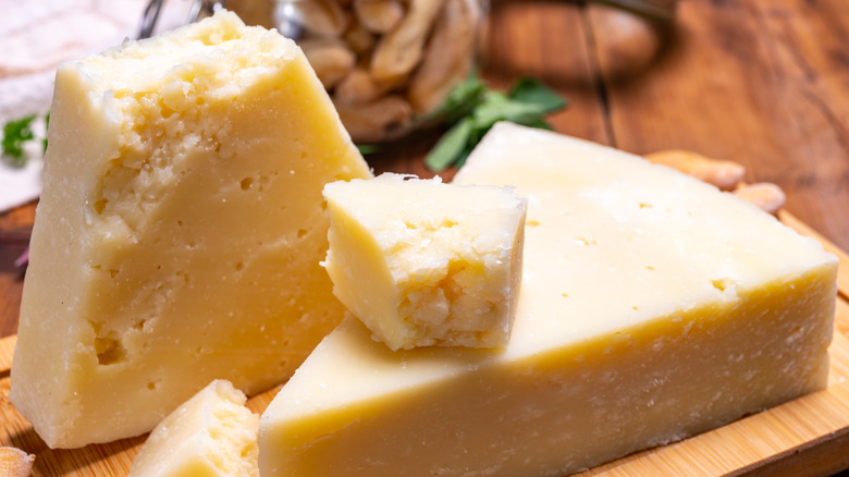 Two wedges of Pecorino Romano cheese.