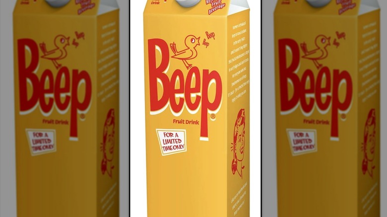 A carton of Beep Fruit Drink; carton is yellow with a white plastic cap; logo is "Beep" in red with a cartoon bird chirping "beep, beep"