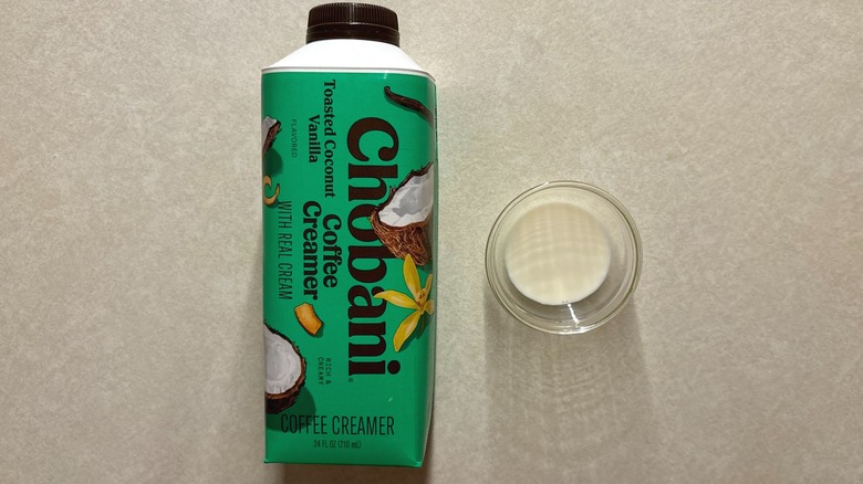 Chobani Toasted Coconut Vanilla Dairy Creamer bottle and creamer in glass ramekin