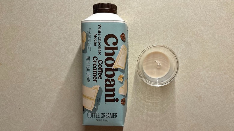 Chobani White Chocolate Mocha Dairy Creamer bottle and creamer in glass ramekin