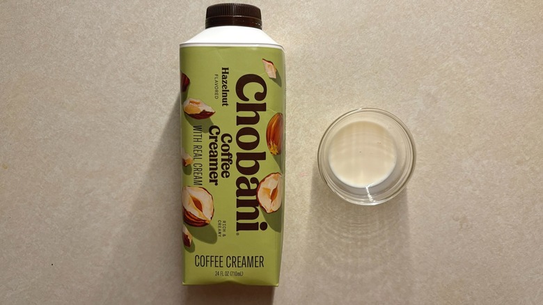 Chobani Hazelnut Dairy Creamer bottle and creamer in glass ramekin