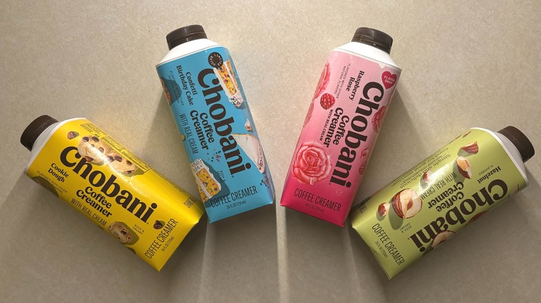 Four Chobani creamer bottles on a counter