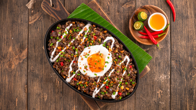 Plate of Sisig with a fried egg on top