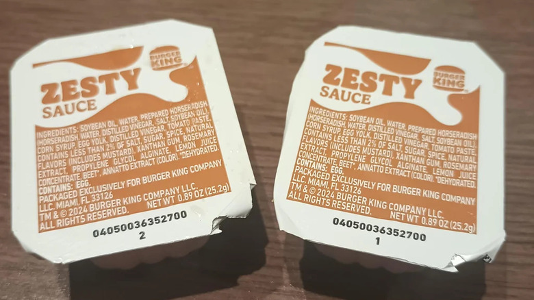 Two pots of Burger King Zesty Sauce