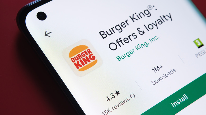 A phone displaying the Burger King app