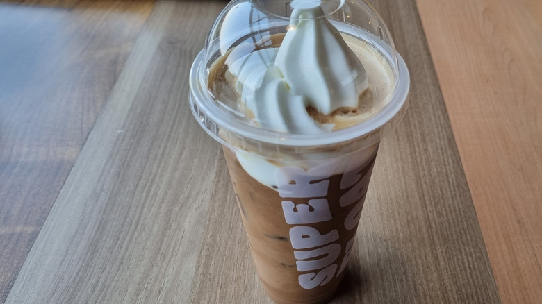 A Burger King Super Float in a clear plastic cup