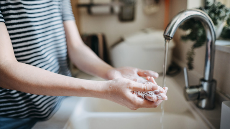 Woman washing her hands