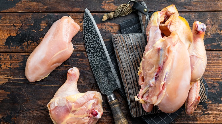 Cutting whole raw chicken