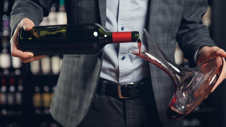 Pouring wine into decanter