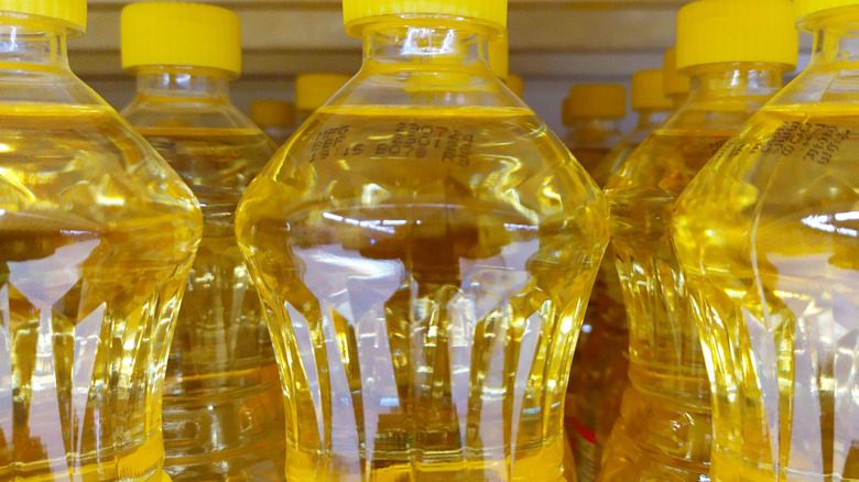 Bottles of vegetable oil in store
