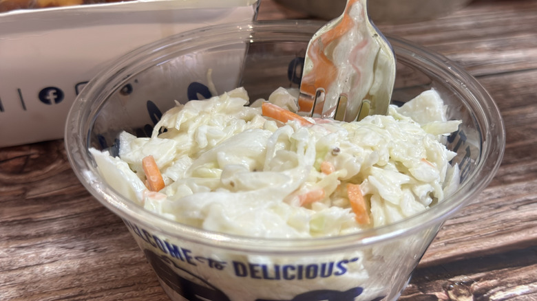 Culver's Medium Coleslaw in plastic cup with fork in it