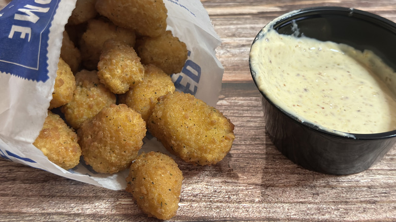 Culver's Wisconsin Cheese Curds (medium) in bag with sauce on the side