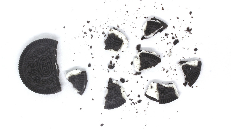 A crushed Oreo against a white background