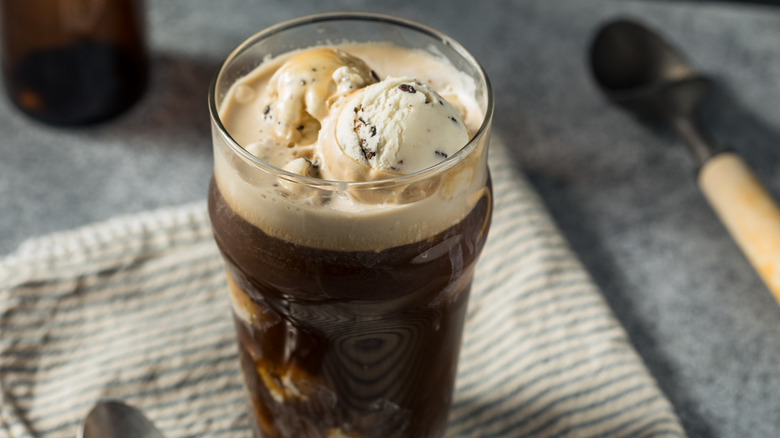 A dark-colored float with ice cream